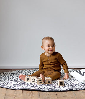 Tapis rond matelassé en coton biologique Toddlekind - Play Mats par Toddlekind